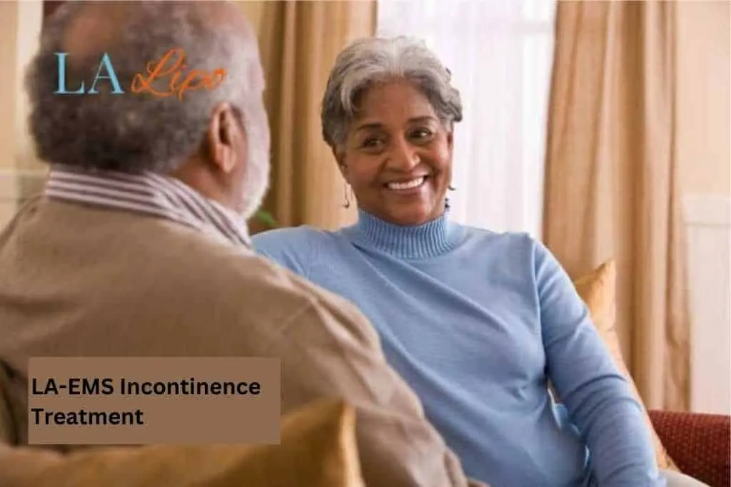 Couple sat smiling at each other - LA-EMS treatment West Kilburn