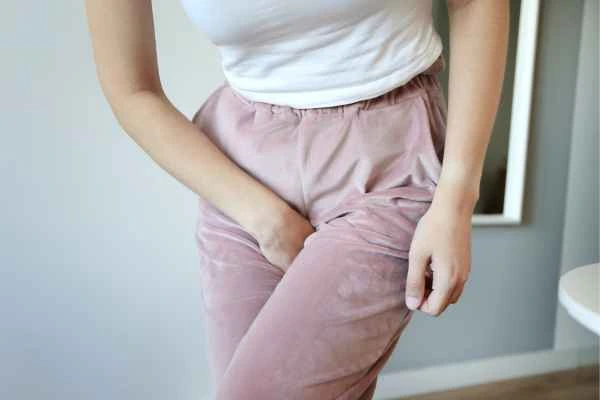 woman running for the toilet because of urinary incontinence West Kilburn